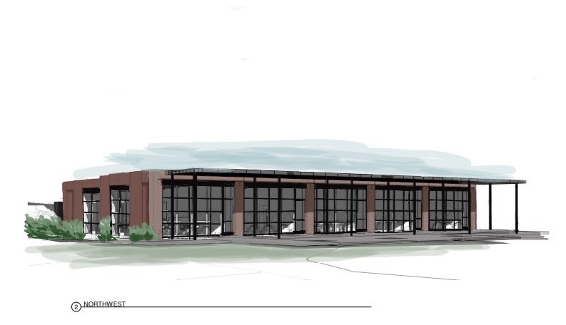 Image is a rendering of the conceived Kiln renovation and full build out. Image shows the street-facing side of the building with ample windows and a covered portico.