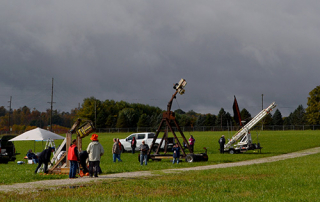 Pumpkin Launch devices lined up in the grass and preparing to launch