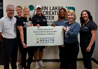 Representatives of the Bloomington Health Foundation pose with Parks and Recreation staff at the Twin Lakes Recreation Center