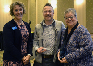 Left to right Mayor Kerry Thomson, Parks and Recreation Director Tim Street, and Parks and Recreation's Recreation Services Division Director Becky Higgins accept the Outstanding Agency and Distinguished Life Member awards at the Indiana Park and Recreation Association annual conference Nov. 7, 2024.