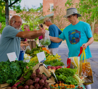 Jim vending green beans at his produce stand