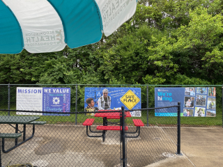 Youth Services Bureau and City of Bloomington Human Resources banners at Mills Pool 2025