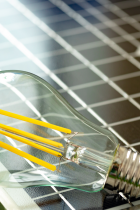 LED bulb sitting on top of a solar panel