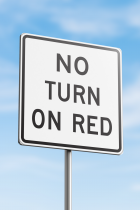 no turn on red sign in front of blue sky
