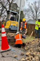 crews digging and installing fiber conduit. 