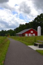 Red barn and restored native prairie at Rogers Family Park in July 2023.