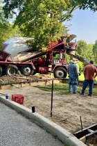 Concrete curbs being poured around the pad that upon which fitness equipment will be installed at Southeast Park.